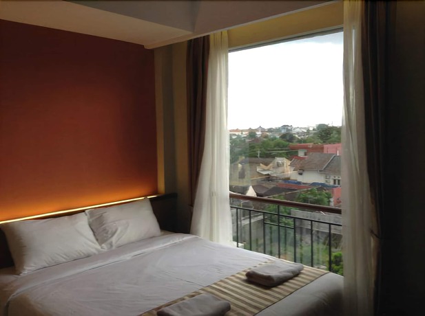 Imagen de la habitación del Hotel Loji Solo. Foto 12