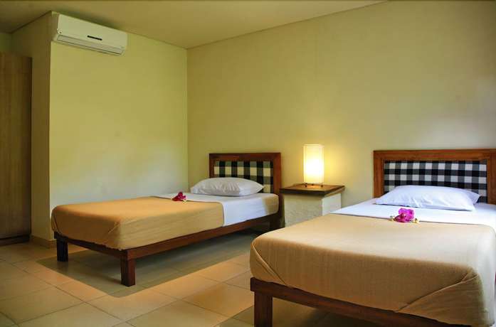 Imagen de la habitación del Hotel Lokasari Bungalows Spa and Gallery. Foto 2