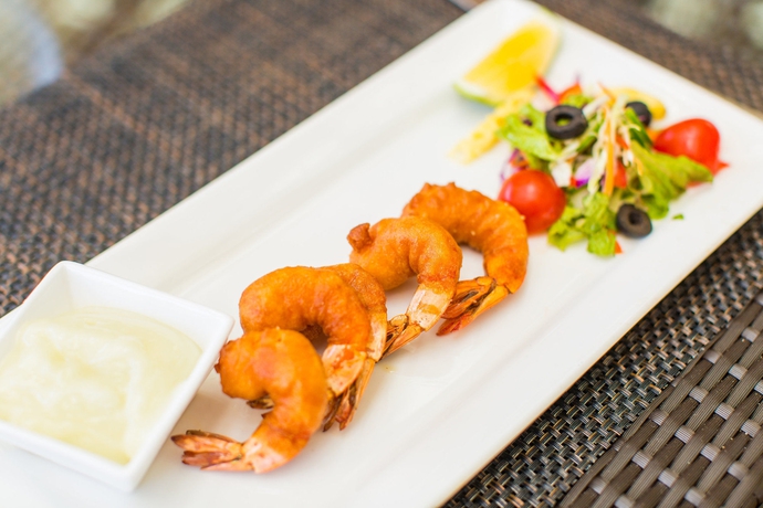 Imagen del bar/restaurante del Hotel Lomani Island Resort - Adults Only. Foto 2