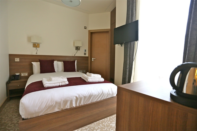 Imagen de la habitación del Hotel London King's. Foto 9
