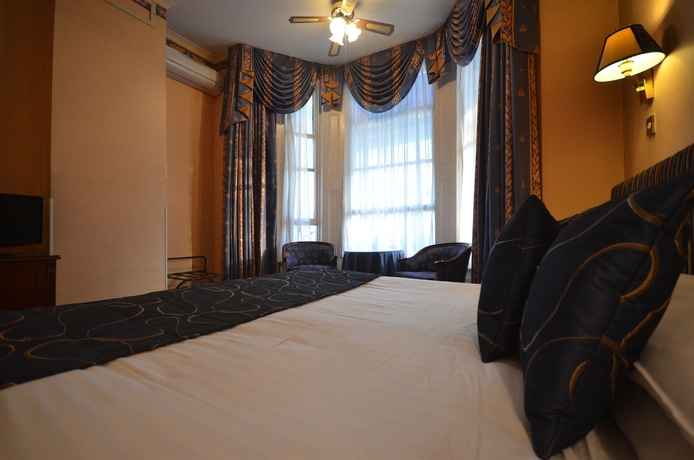 Imagen de la habitación del Hotel London Lodge. Foto 12