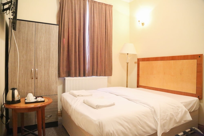 Imagen de la habitación del Hotel London Shelton. Foto 17