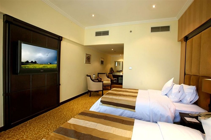 Imagen de la habitación del Hotel London Suites. Foto 8