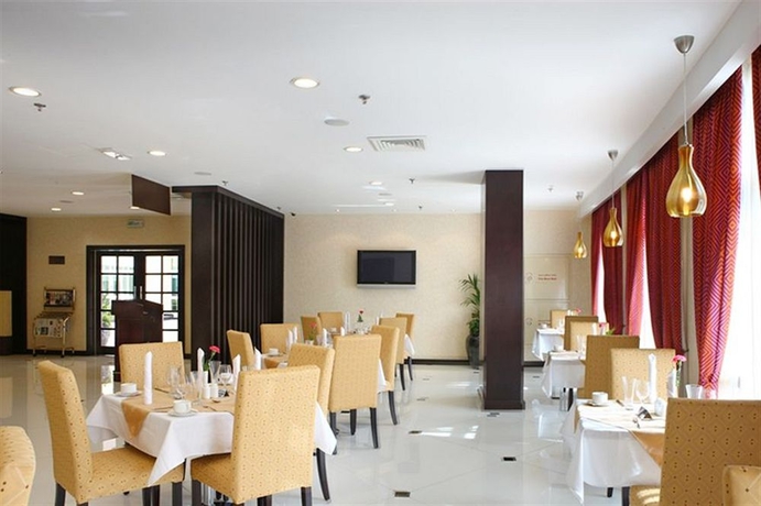 Imagen del bar/restaurante del Hotel London Suites. Foto 5