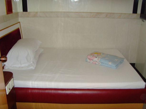 Imagen de la habitación del Hotel Long Yuen. Foto 12