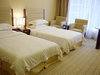 Imagen de la habitación del Hotel Long Zhou. Foto 3