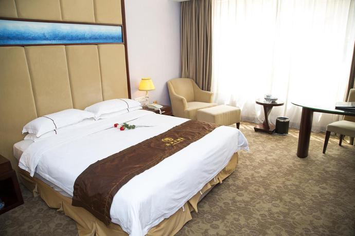 Imagen de la habitación del Hotel Long Zhou. Foto 7