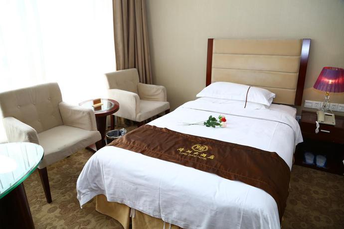 Imagen de la habitación del Hotel Long Zhou. Foto 8