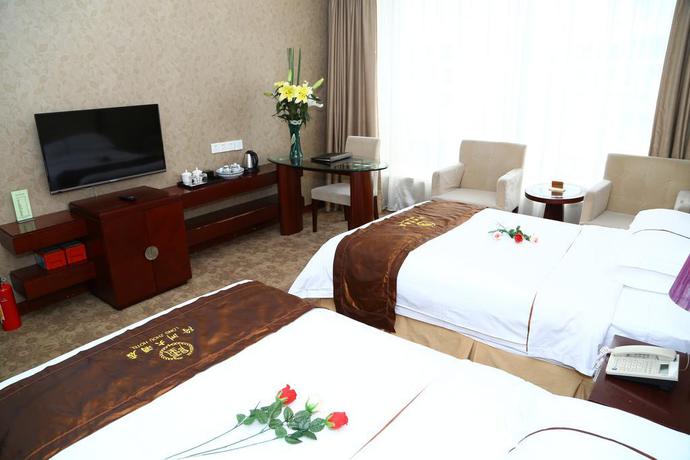 Imagen de la habitación del Hotel Long Zhou. Foto 13