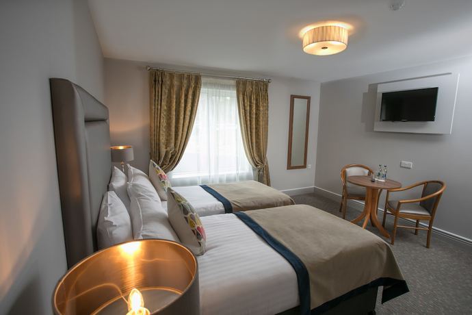Imagen de la habitación del Hotel Longcourt House. Foto 17