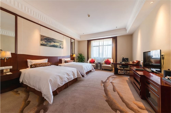 Imagen de la habitación del Hotel Longqi Jianguo. Foto 16