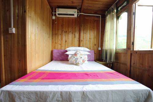 Imagen de la habitación del Hotel Longsheng Golden Dragon Country Villa. Foto 4