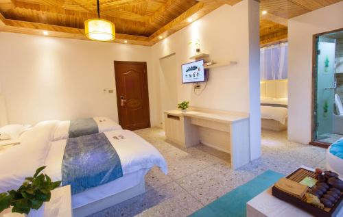 Imagen de la habitación del Hotel Longsheng Longji Puchuo Shengxiang Art. Foto 6