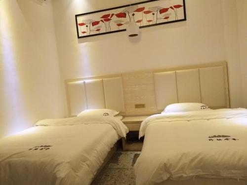 Imagen de la habitación del Hotel Longsheng Longji Puchuo Shengxiang Art. Foto 8