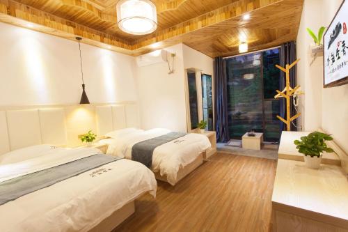 Imagen general del Hotel Longsheng Longji Puchuo Shengxiang Art. Foto 4