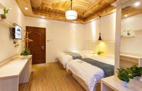 Imagen general del Hotel Longsheng Longji Puchuo Shengxiang Art. Foto 5