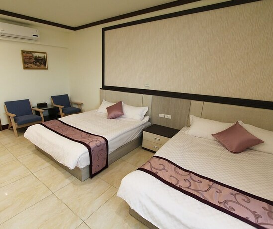 Imagen de la habitación del Hotel Longxing Bandb. Foto 17
