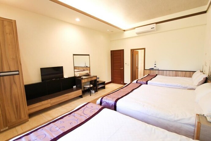 Imagen de la habitación del Hotel Longxing Bandb. Foto 21