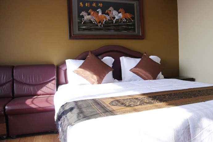 Imagen de la habitación del Hotel Longzhu Guesthouse. Foto 4