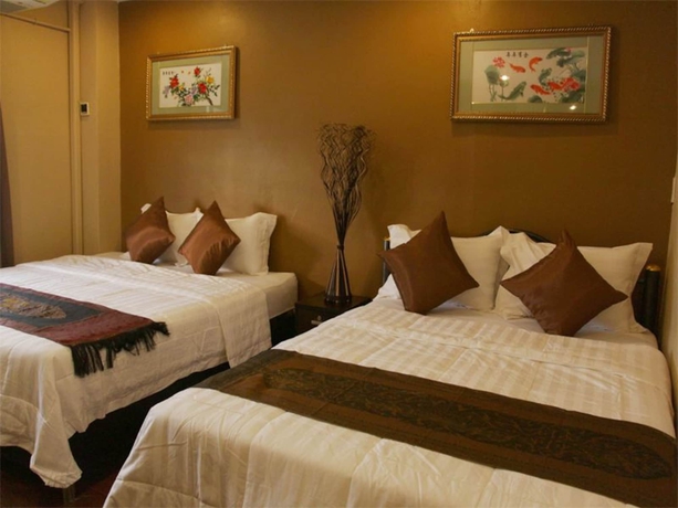 Imagen de la habitación del Hotel Longzhu Guesthouse. Foto 8