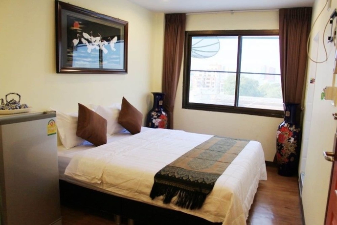 Imagen de la habitación del Hotel Longzhu Guesthouse. Foto 10