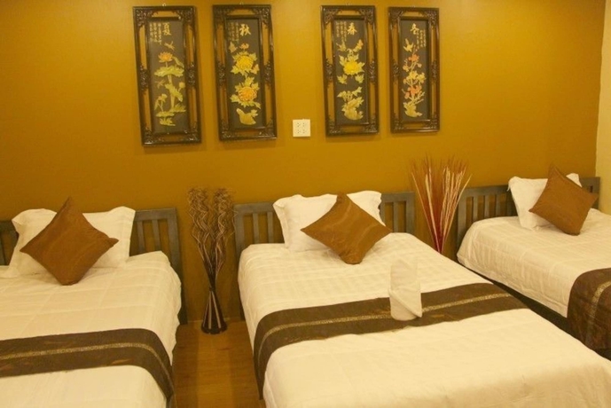 Imagen de la habitación del Hotel Longzhu Guesthouse. Foto 12
