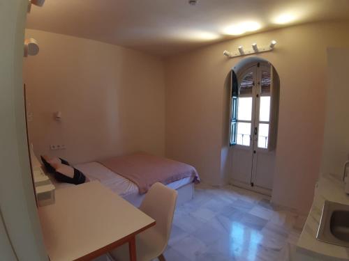 Imagen de la habitación del Hotel Loop Homes Palace Granada. Foto 17