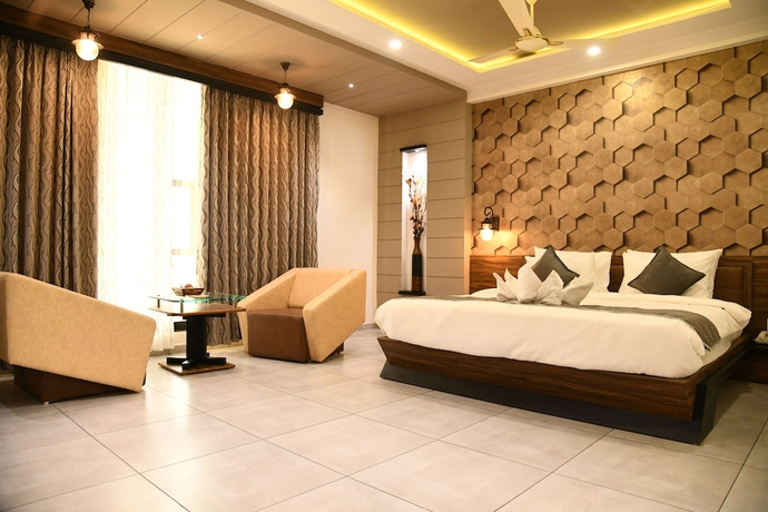 Imagen de la habitación del Hotel Lords Eco Inn Morbi. Foto 7