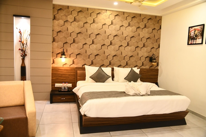 Imagen de la habitación del Hotel Lords Eco Inn Morbi. Foto 10