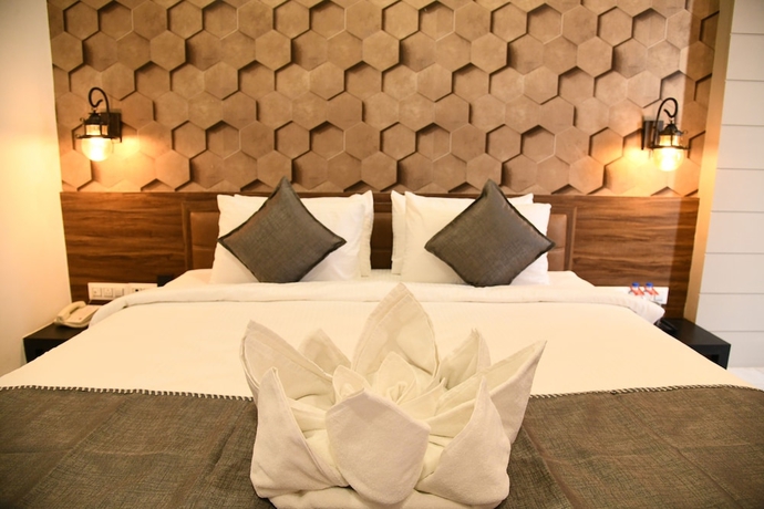 Imagen de la habitación del Hotel Lords Eco Inn Morbi. Foto 12