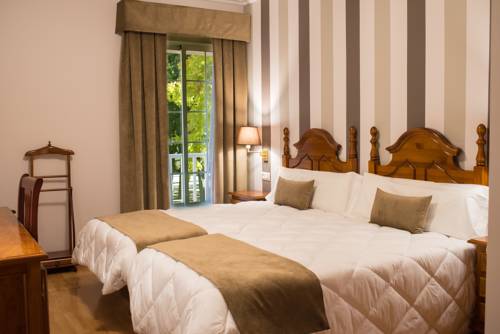 Imagen de la habitación del Hotel Los Cazadores. Foto 5