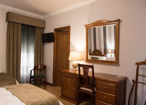 Imagen de la habitación del Hotel Los Cazadores. Foto 9