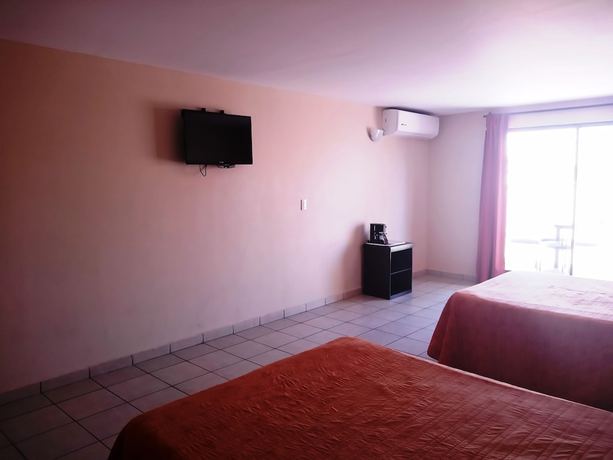 Imagen de la habitación del Hotel Los Jitos and Suites. Foto 4