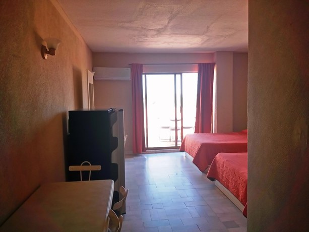 Imagen de la habitación del Hotel Los Jitos and Suites. Foto 6