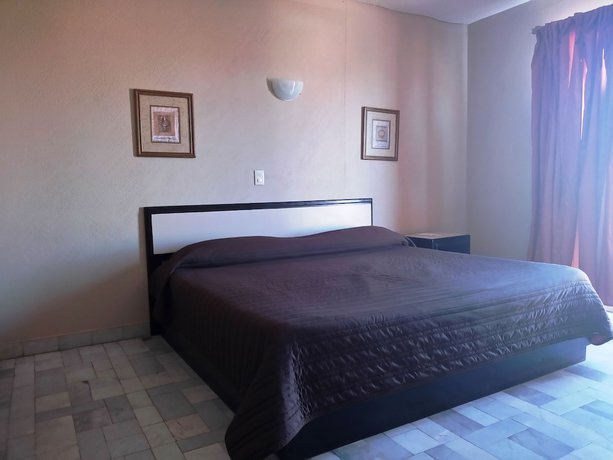 Imagen de la habitación del Hotel Los Jitos and Suites. Foto 8