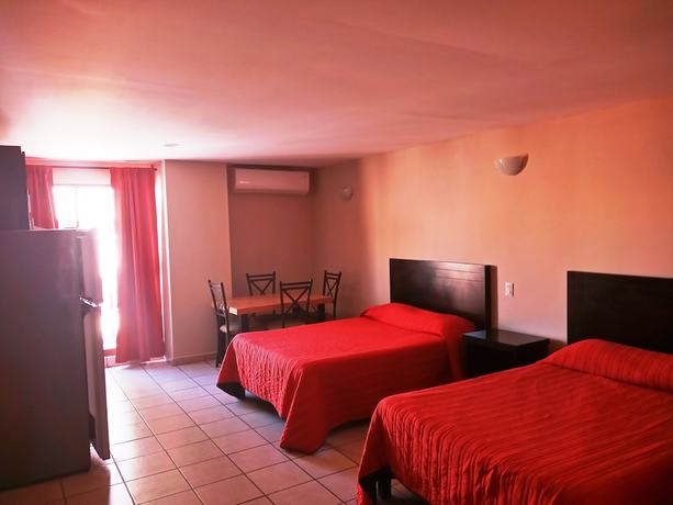Imagen de la habitación del Hotel Los Jitos and Suites. Foto 9