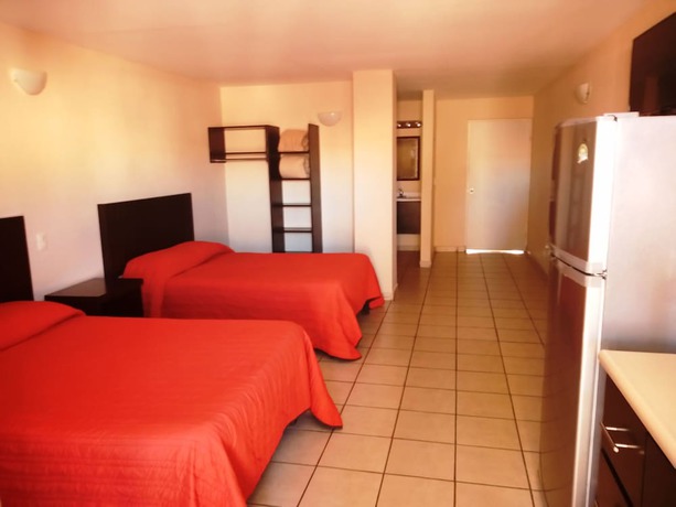 Imagen de la habitación del Hotel Los Jitos and Suites. Foto 11