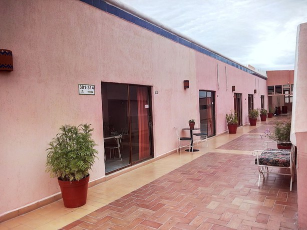 Imagen de la habitación del Hotel Los Jitos and Suites. Foto 13