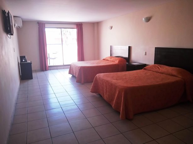 Imagen de la habitación del Hotel Los Jitos and Suites. Foto 15