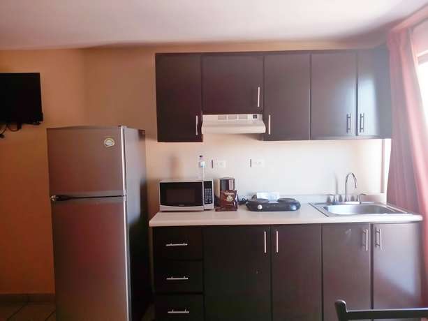 Imagen de la habitación del Hotel Los Jitos and Suites. Foto 17