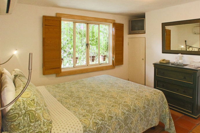 Imagen de la habitación del Hotel Los Milagros. Foto 10