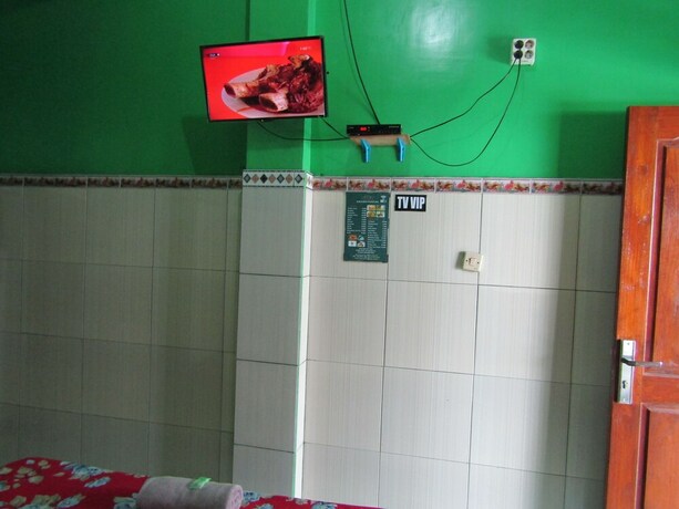 Imagen de la habitación del Hotel Losmen Kinasih Puncak and Gazebo Pandang. Foto 19