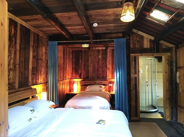 Imagen de la habitación del Hotel Lost World Sanjiang. Foto 12