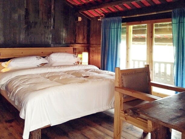 Imagen de la habitación del Hotel Lost World Sanjiang. Foto 17