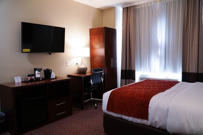 Imagen de la habitación del Hotel Lotus BLU Inn and Suites. Foto 6