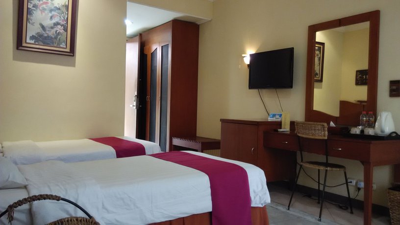 Imagen de la habitación del Hotel Lotus Garden. Foto 10