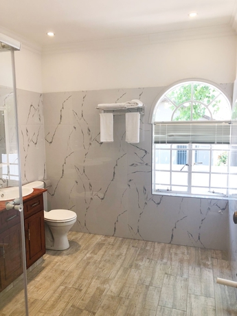 Imagen de la habitación del Hotel Lotus Guest House, Sandton. Foto 15