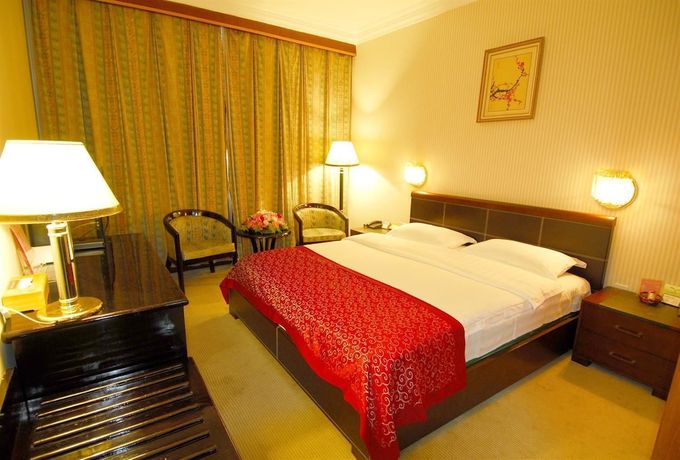 Imagen de la habitación del Hotel Lotus Hotel, Kunming. Foto 12