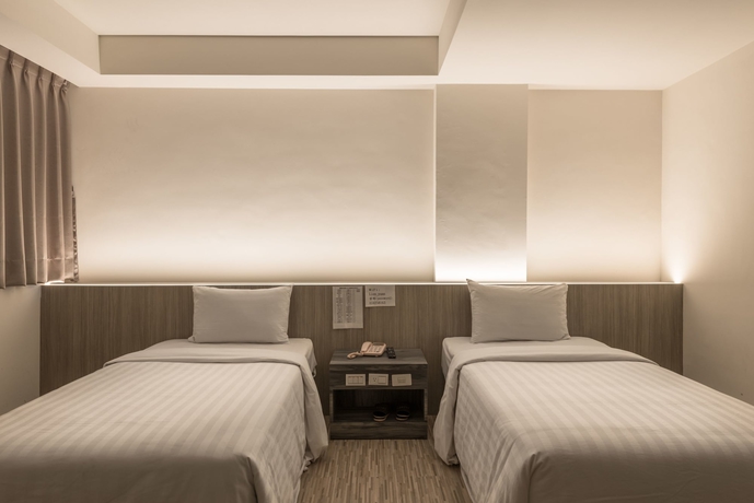 Imagen de la habitación del Hotel Lotus Yuan Business. Foto 5