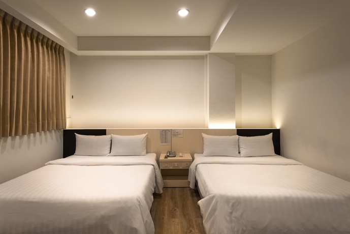 Imagen de la habitación del Hotel Lotus Yuan Business. Foto 6